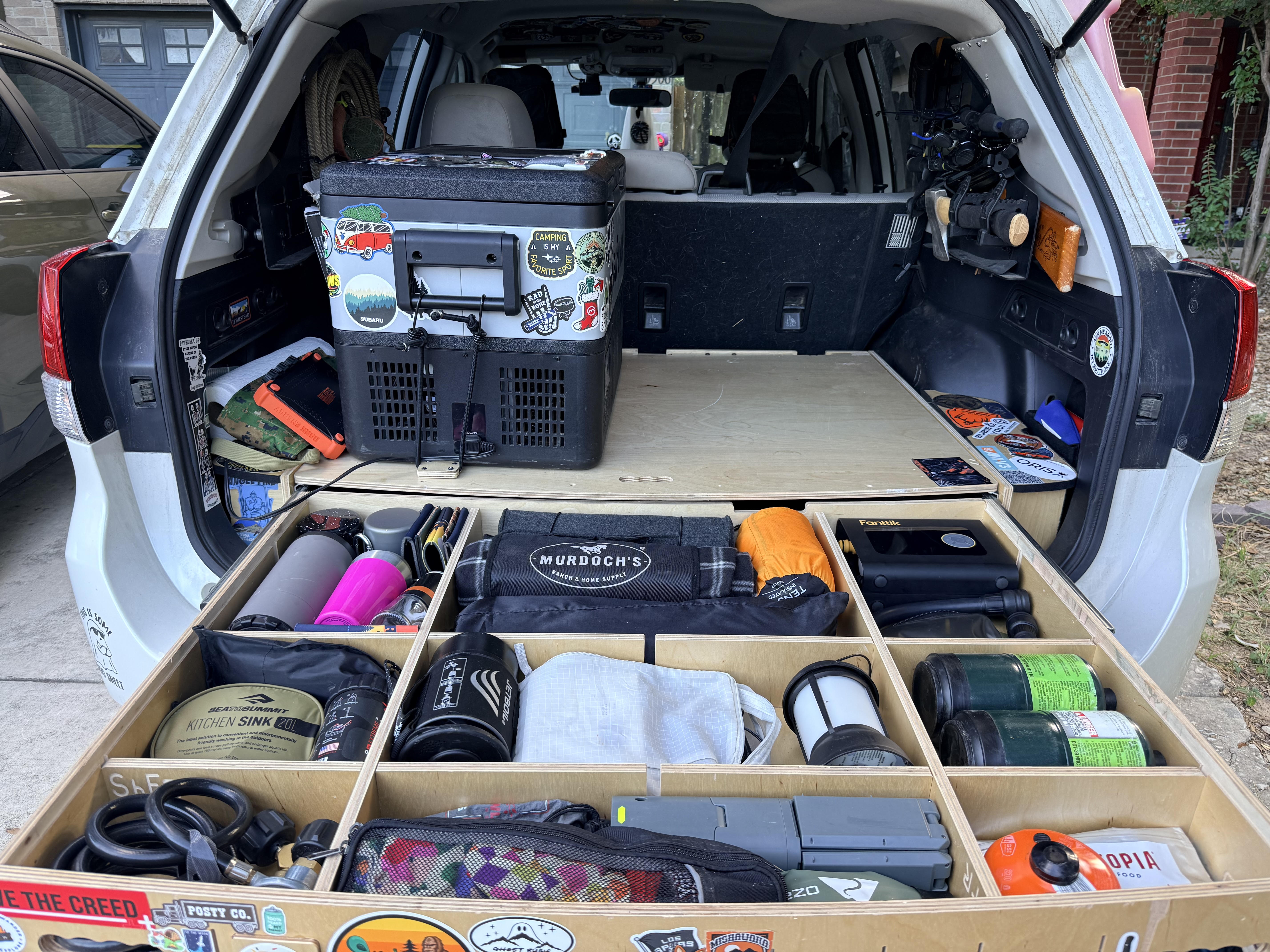 The Ghost's loaded cargo bay with the wooden drawer system